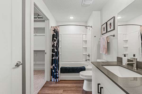 A bathroom with a toilet, sink, and bathtub. at The Revival, Salt Lake City